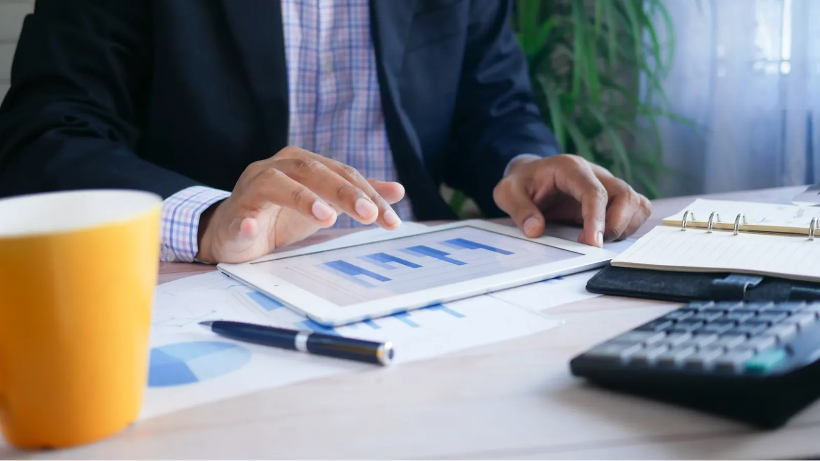 Analyst reviewing financial information for an SR&ED claim on a tablet.
