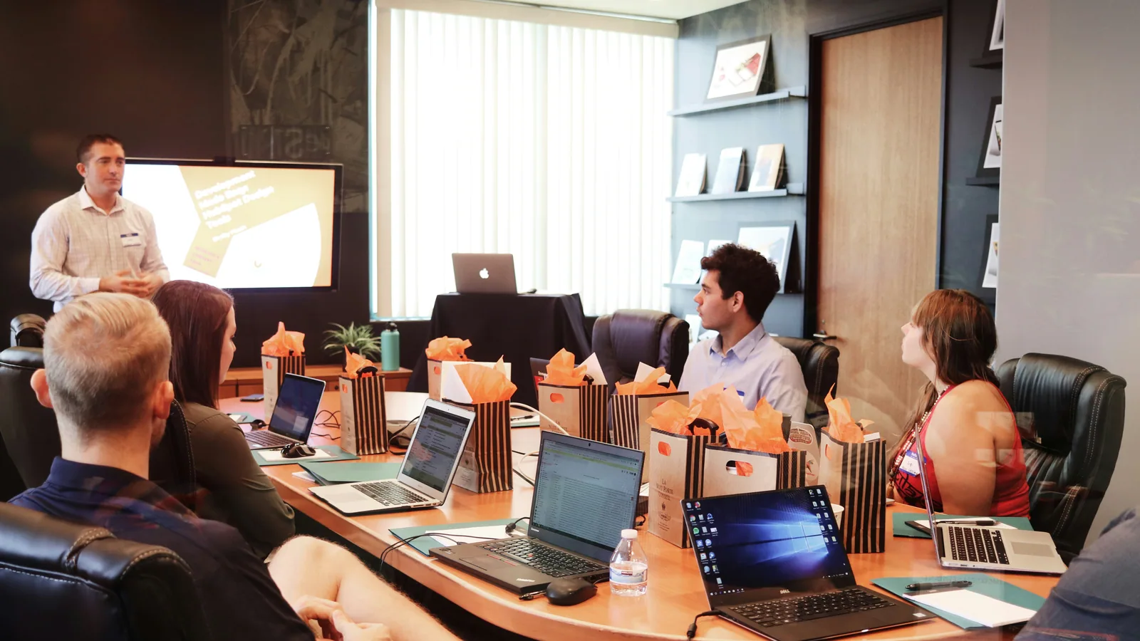 Advisor presenting the streams of a grant program to business leaders.